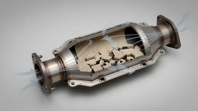 Cutaway illustration of a catalytic converter with damaged honeycomb passages restricting exhaust flow.