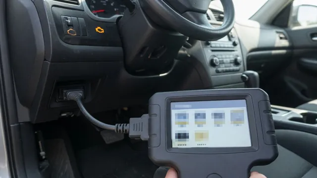 OBD-II scan tool plugged in under a car dashboard to read a stored trouble code, with the check engine light on