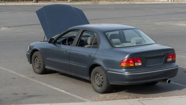 Car parked outdoors with the exhaust outlet visible during an inspection for popping noises