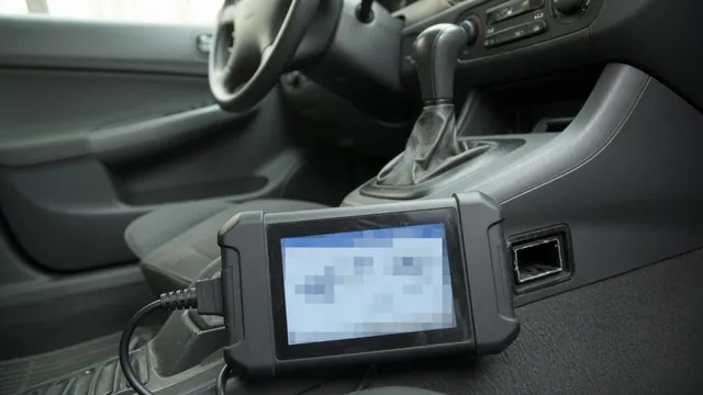 OBD-II scan tool plugged into a car's diagnostic port, showing a trouble code on its screen