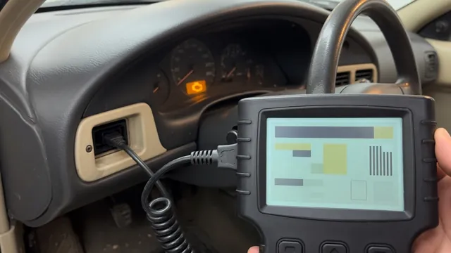 OBD-II scan tool connected under a car dashboard reading a trouble code, with the check engine light on