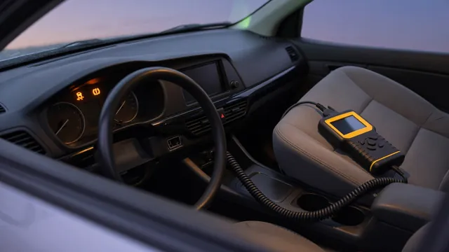 Car dashboard showing amber stability and traction control warning lights with a diagnostic scan tool connected nearby