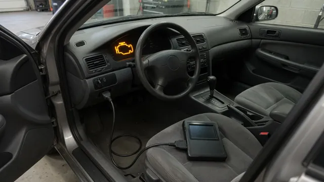 Diagnostic scanner connected inside a parked car with the check engine light illuminated