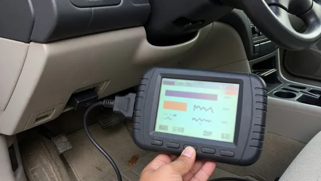 OBD-II scan tool connected under a car dashboard to read a P1485 manufacturer-specific trouble code