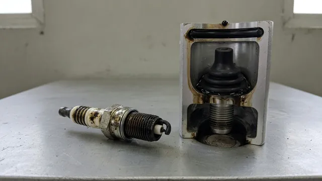 Spark plug with deposits on its firing tip and a cutaway showing oil collected in a spark plug well