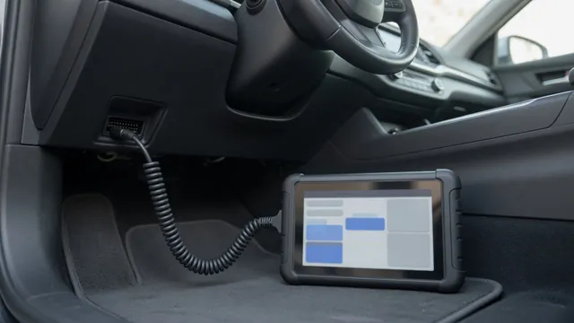 Scan tool connected to a car's OBD-II port showing a list of network communication trouble codes