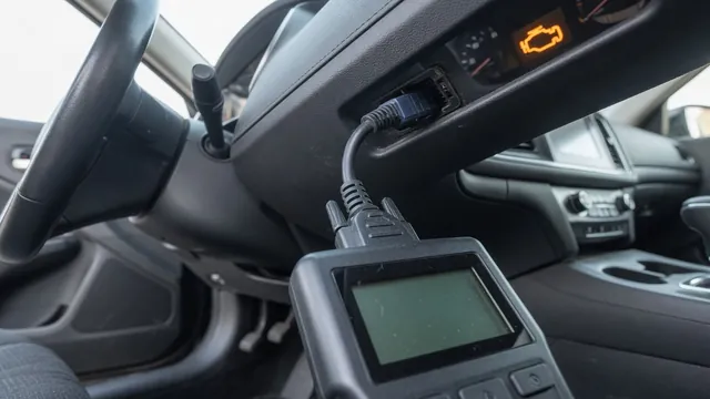 OBD-II scan tool plugged into a car's diagnostic port, with the check engine light on in the background