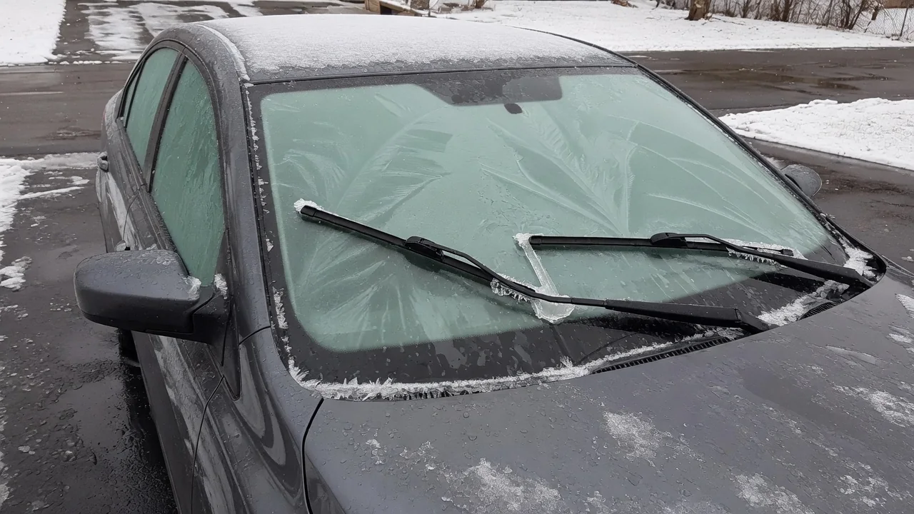 Automotive scene illustrating Why Do Wiper Blades Stick to the Windshield in Winter