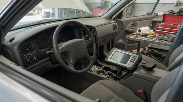 Vehicle ignition switch and instrument cluster with a diagnostic scanner nearby