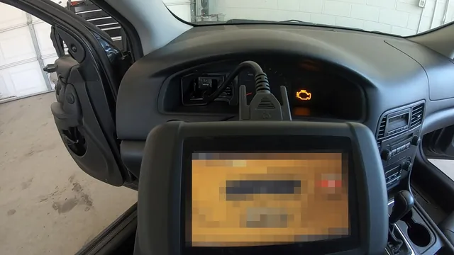 OBD-II scan tool connected under a car dashboard to read a P1509 trouble code, with the check engine light on
