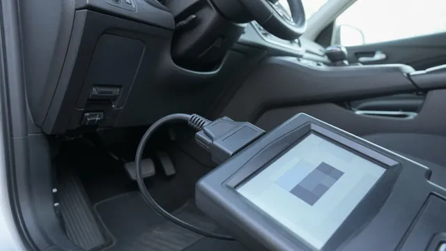 OBD-II scan tool plugged into a car's diagnostic port, reading a stored engine trouble code