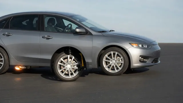 Parked car with highlighted areas around the exhaust, front suspension, and front axle