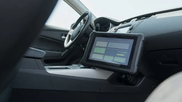 OBD-II scan tool connected under a car dashboard, showing a diagnostic trouble code reading