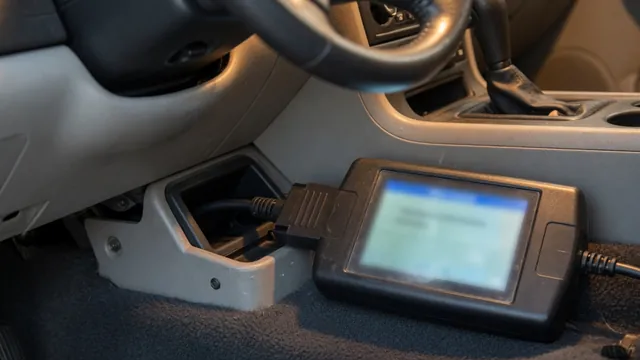 Handheld OBD-II scan tool plugged into a car's diagnostic port to read a stored trouble code