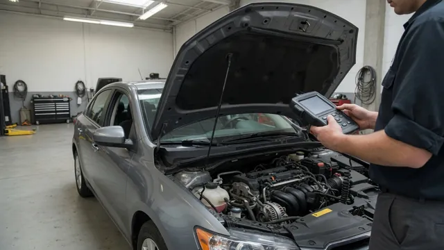 Technician reviewing diagnostic scan data beside a parked vehicle with its hood open