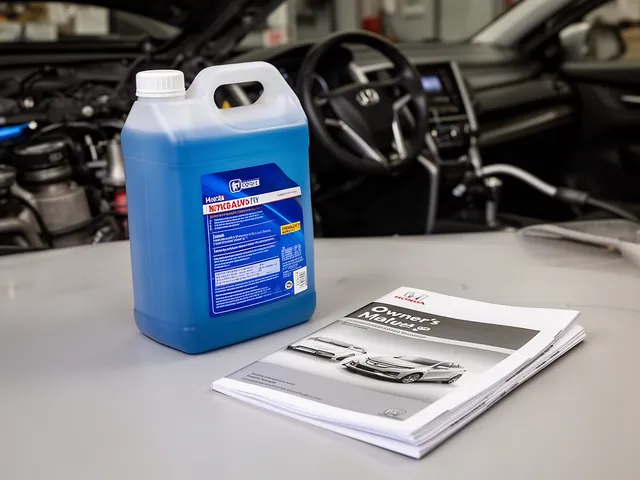 Blue engine coolant in a sealed container beside a Honda owner’s manual on a workbench