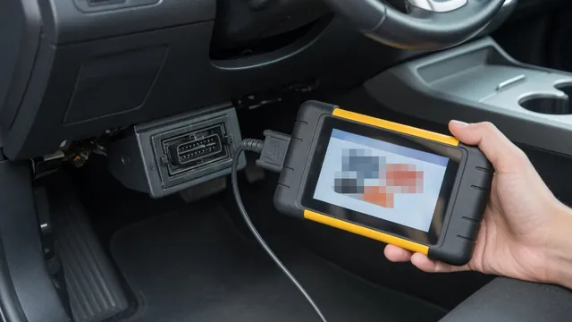 Technician using an OBD-II scan tool plugged in under a car dashboard to read a manufacturer-specific trouble code