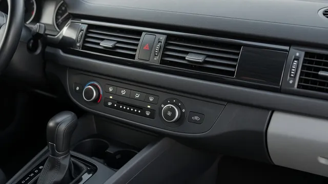 Car dashboard with climate controls and vents where HVAC clicking may be heard