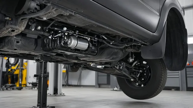 Technician inspecting the fuel supply pump area beneath a parked 6.0 Powerstroke truck