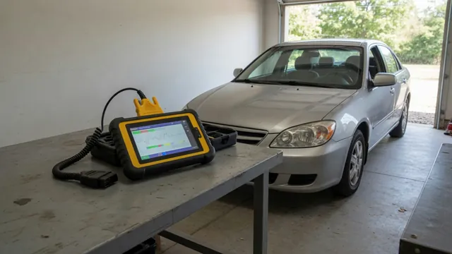 Diagnostic scanner beside a vehicle with the P1336 trouble code displayed