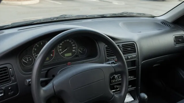 Dashboard with a steady idle reading and no illuminated check engine light in a parked car