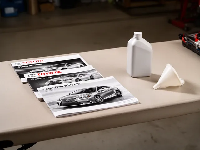 Toyota and Lexus owner's manuals beside a sealed steering fluid bottle on a garage workbench