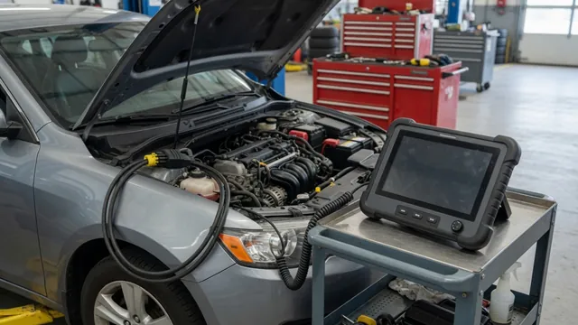 Diagnostic scanner beside an open engine bay during a misfire inspection