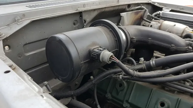 Diesel intake air heater housing with an electrical connector and nearby wiring