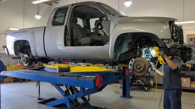 Ram 1500 front wheel and hub area during a professional wheel bearing inspection