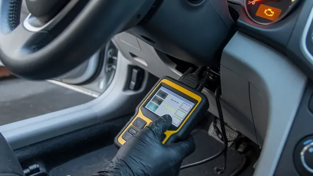 OBD-II scan tool plugged into a car's diagnostic port with the check engine light on
