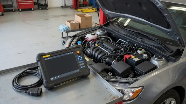 Diagnostic scan tool beside an engine bay during a trouble-code inspection