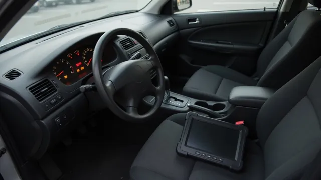Dashboard showing steering, brake and stability warning symbols beside a diagnostic scan tool