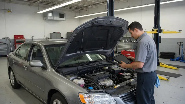 Nissan Altima parked with its hood open for a professional charging system inspection