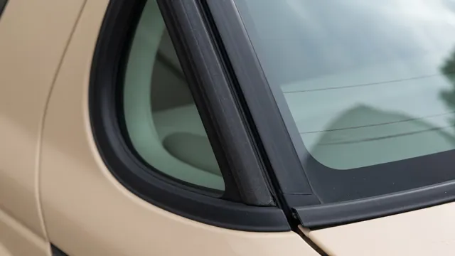 Close-up of a car door window frame showing the rubber weatherstrip seal along the glass edge
