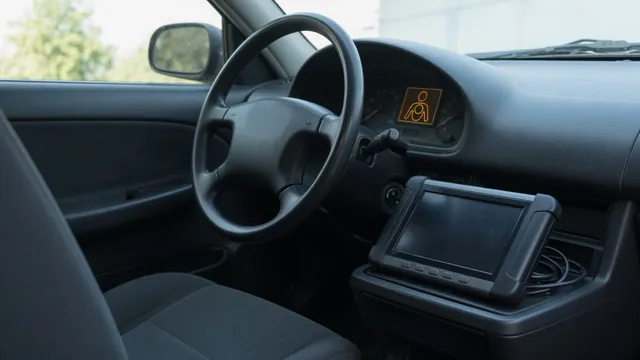 Airbag warning light on an instrument panel with a diagnostic scanner beside the steering wheel
