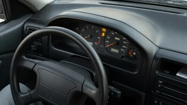 Dashboard with illuminated check engine and traction control warning symbols