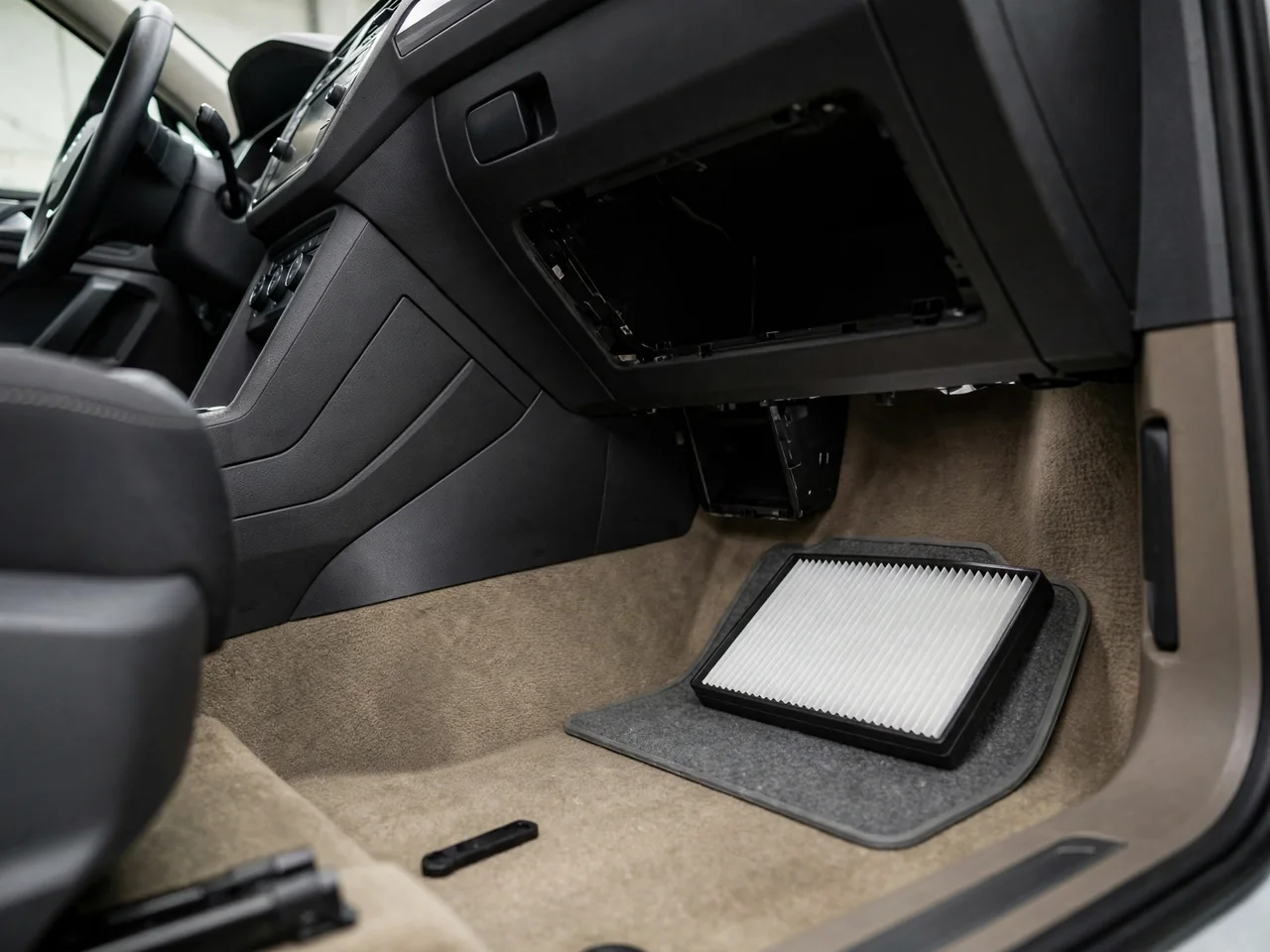 Volkswagen Tiguan passenger footwell with a cabin air filter ready for installation