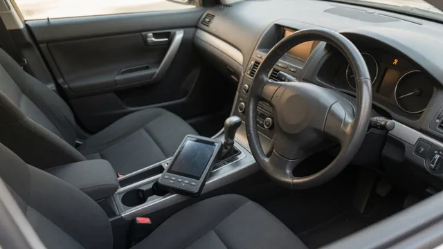 Illuminated airbag warning light with a diagnostic scanner beside the steering wheel