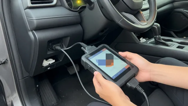 OBD-II scan tool connected under a car dashboard displaying a diagnostic trouble code