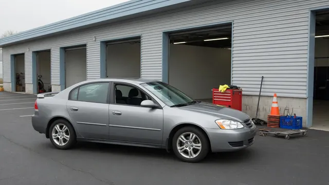 Nissan Murano parked outside an automotive service shop for a transmission inspection