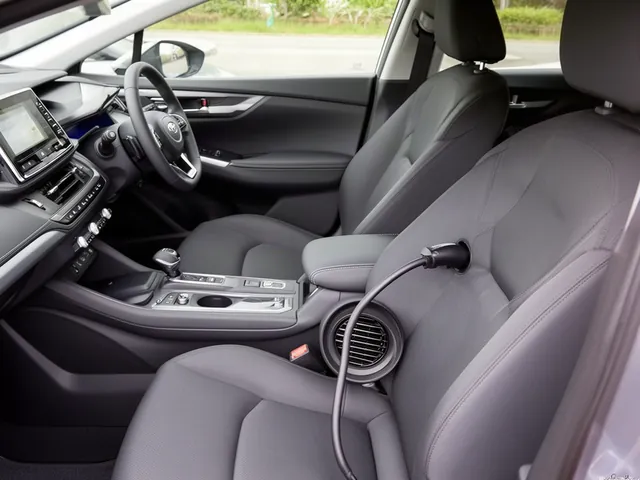 Unobstructed hybrid battery cooling intake beside a clean rear seat, with the battery enclosure closed
