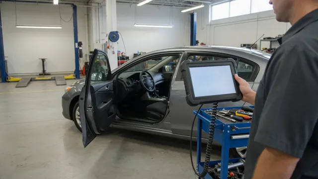 Technician reviewing vehicle diagnostic information on a scan tool in an automotive workshop