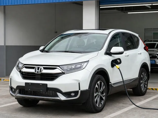 Honda CR-V Hybrid parked outside an automotive service center for a battery assessment