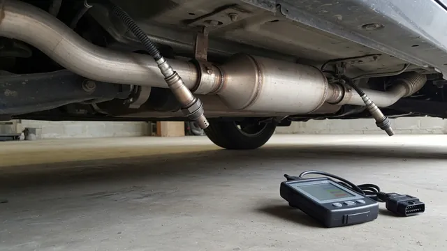 Catalytic converter with upstream and downstream oxygen sensors and an OBD-II scan tool used to diagnose a P0420 code