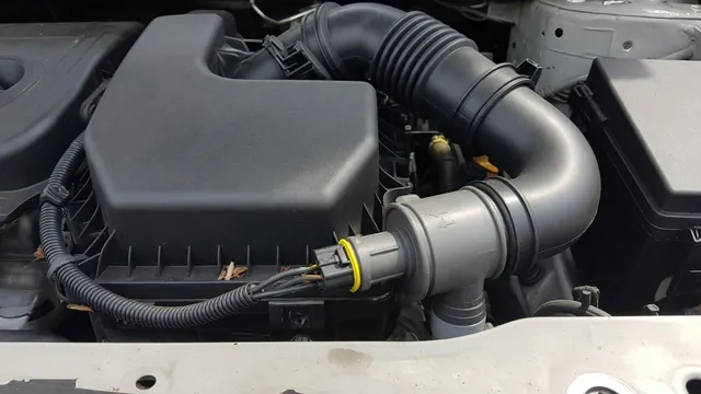 Intake duct and air filter housing in a compact crossover engine bay, with an inline mass air flow sensor and its connector
