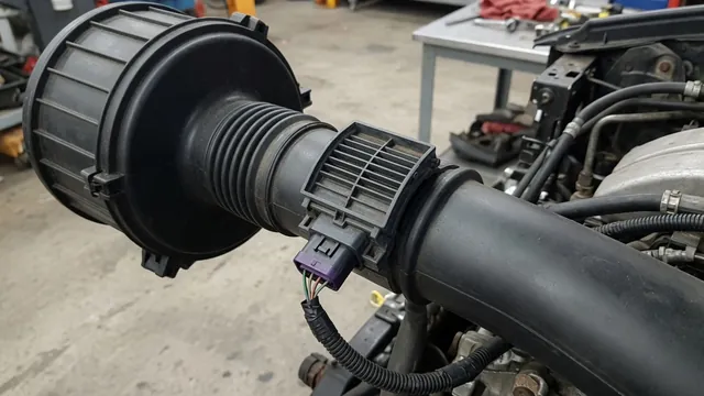 Illustration of a mass air flow sensor mounted in an automotive air intake duct