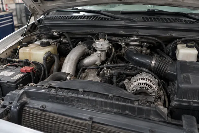 Ford 6.0 Power Stroke engine bay showing the EGR valve and surrounding intake components