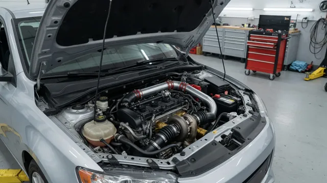 Engine bay showing turbocharger plumbing and charge-air hoses during a visual inspection