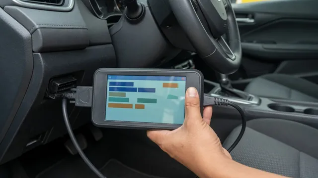 OBD-II scan tool plugged into a car's diagnostic port, reading a stored trouble code
