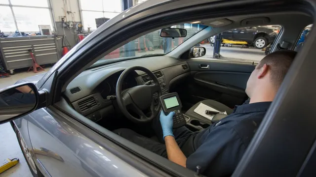 Diagnostic scanner connected inside a parked vehicle while a technician reviews vehicle information